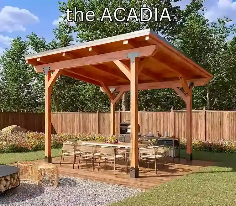 A four-post cedar structure with a solid sloping roof deck over a long dining table on a timber patio, an outdoor kitchen against the fence behind.
