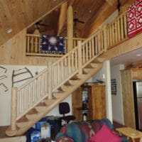 Evergreen home indoor wood staircase to upper loft