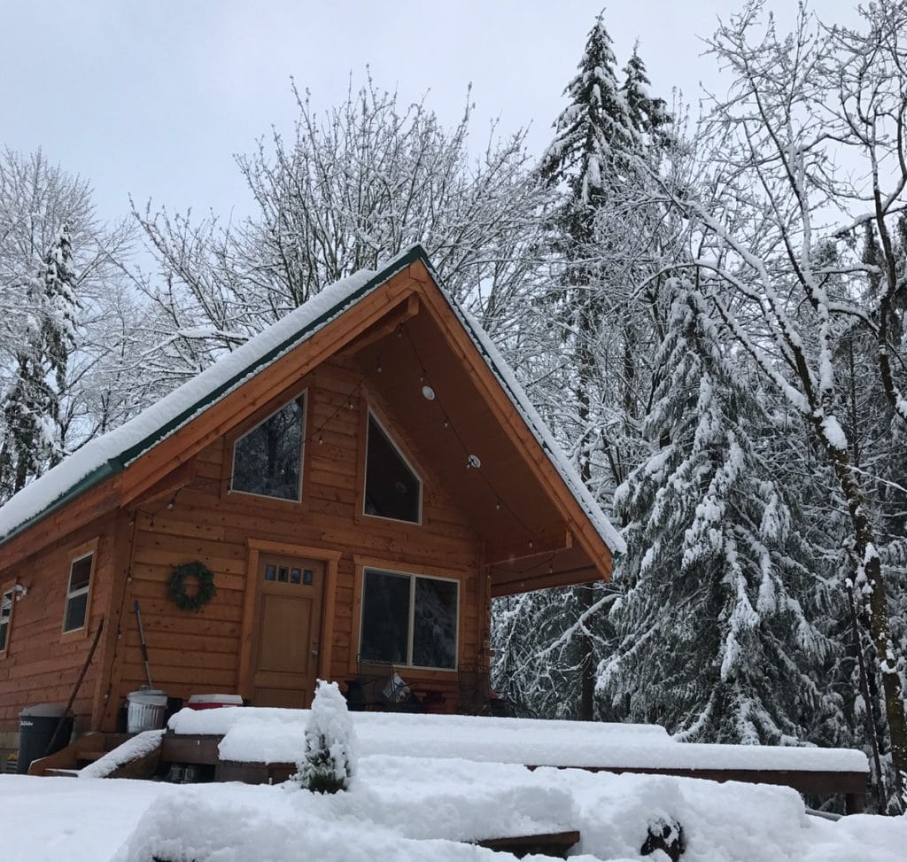 Trapper/Kutkey front view of cabin in scenic snow