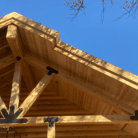 The top joinery of a log cabin roof - part of Sierra Log & Timber's log cabin kits