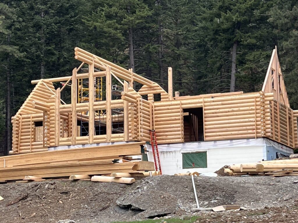 Creating log home with the red cedar barns and logs
